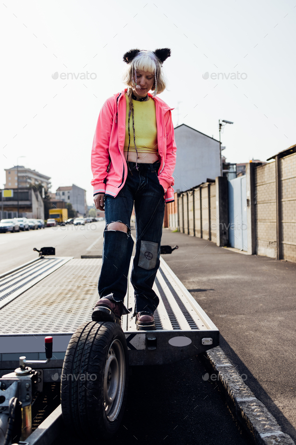 Young nonconformist gen z queer gender fluid woman posing Stock Photo
